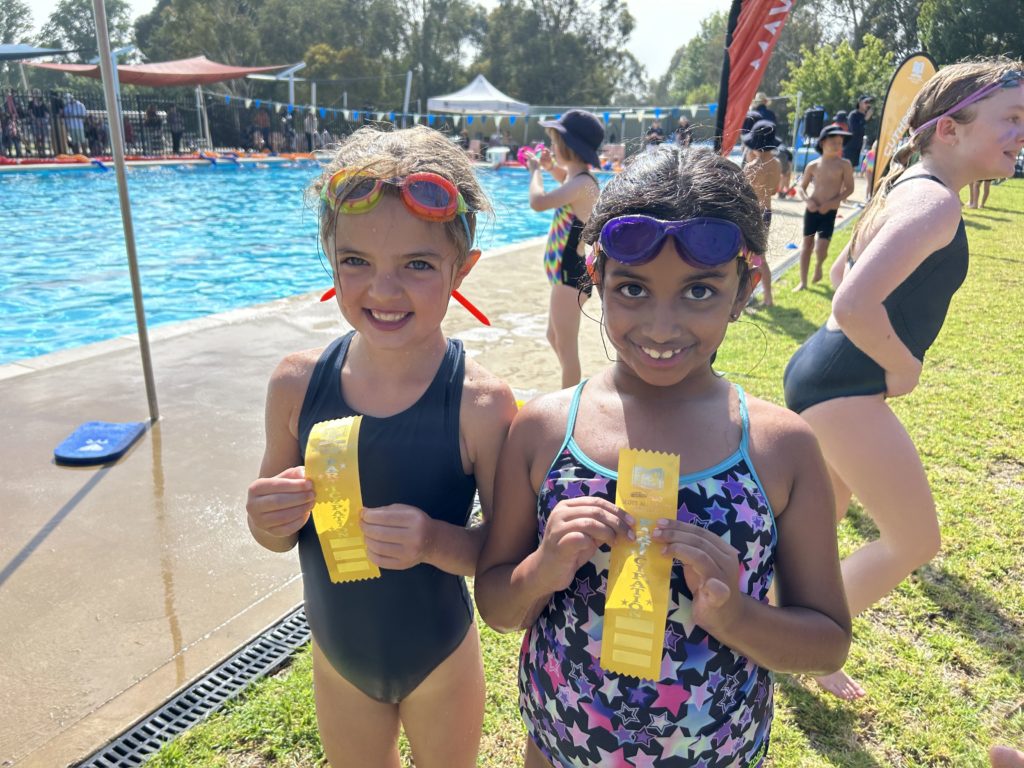 Primary School Students swimming in the Junior School Swimming Carnival at Scots All Saints College.