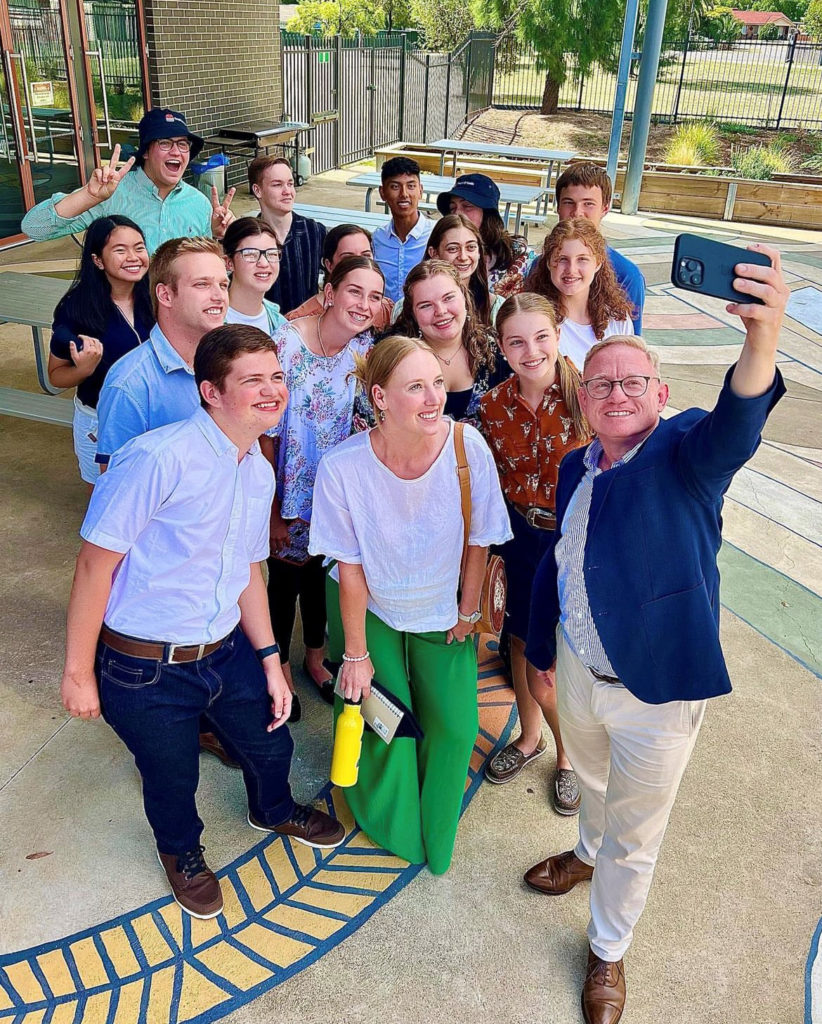 Students on a taskforce pose for a selfie 