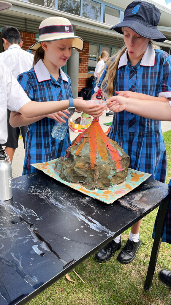 Year 6 Science students making their own volcanoes 