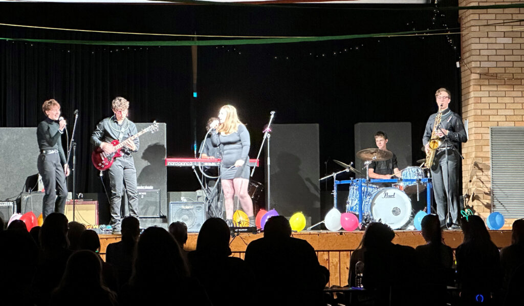 High School band performing at a Battle of the Bands music concert 