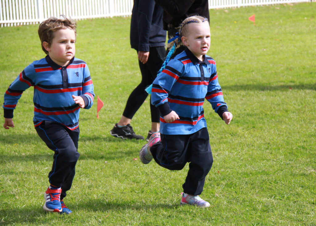 Junior School students running cross country and celebrating with their medals 